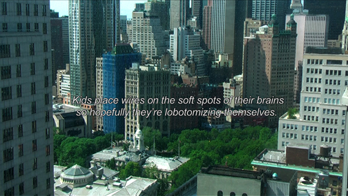 video still of cityscape with text over it