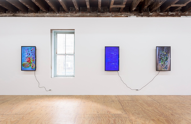 installation shot of three screens with paintstrokes on surface