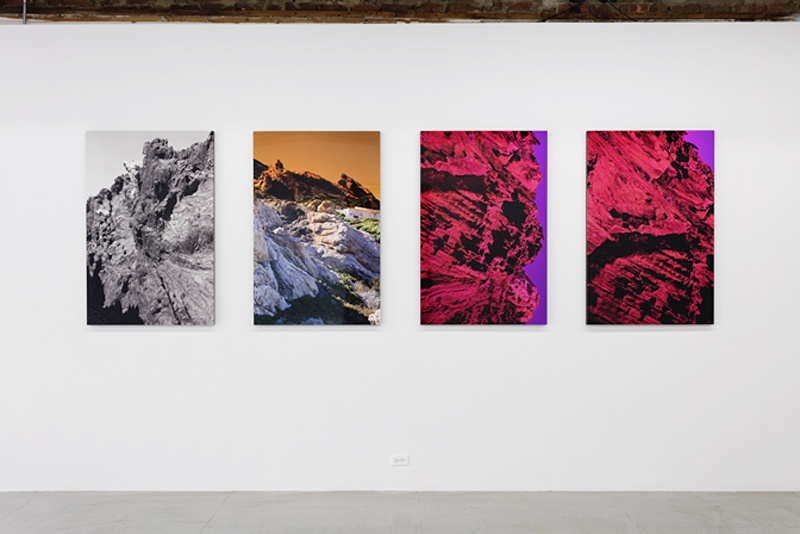 installation shot of Josephine Pryde photos of psychedelic mountains
