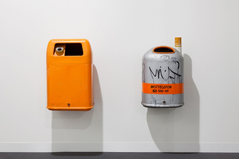 installation image of two trashcans on the wall